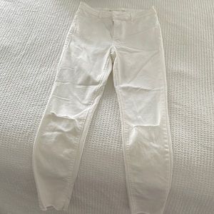 White skinny jeans with rips in knees
